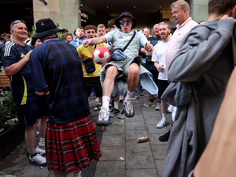 This Scotland fan has a kick about before the game against Germany in Munich.