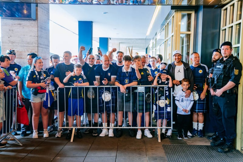 Scotland fans gather outside of the team's hotel, where they had waited for hours to cheer them on in Stuttgart.