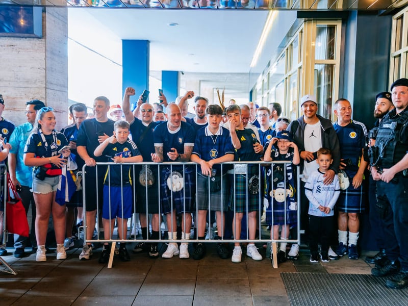 Scotland fans gather outside of the team's hotel, where they had waited for hours to cheer them on in Stuttgart.