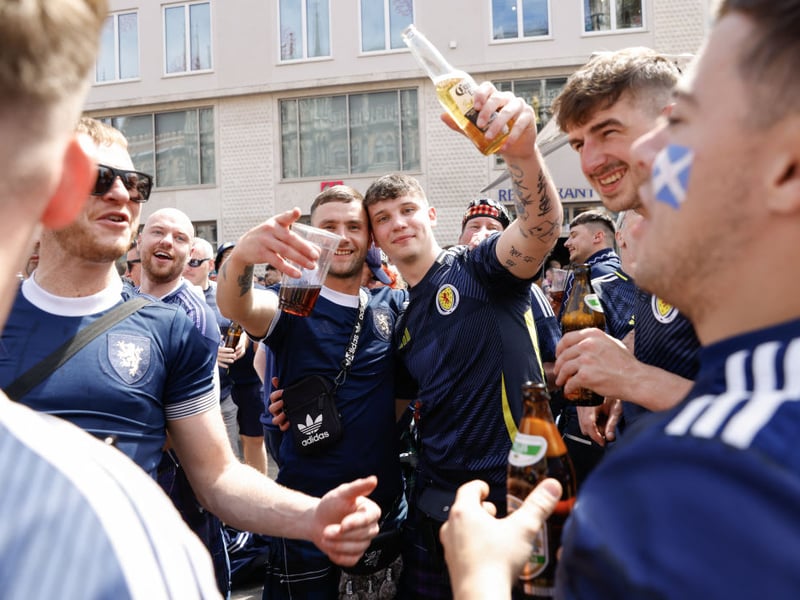 Supporters of Scotland's national soccer team celebrate with beer at the central square Marienplatz.