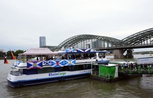 Scotland fans enjoy a ride on the Rhein River in Cologne.