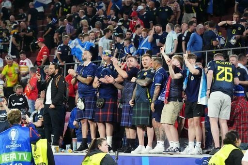 We just love this photo. Fans, watching football and having the time of their lives.