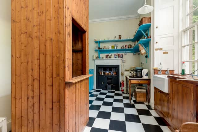 The pantry features a dumb waiter designed to carry meals up to the dining room