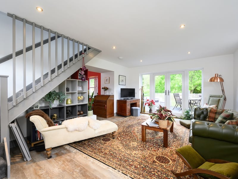 During the summer months the system also produces hot water via an immersion heater. The oil-fuelled Stanley stove in the kitchen provides heating and hot water in the winter,
and there is a back-up diesel generator.