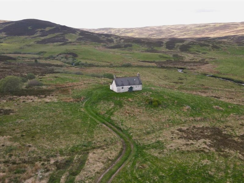 Currently laid out as a sitting room, kitchen, two bedrooms and a bathroom over two floors, the house would need to be taken back to the stone walls and a new layout created within. It is currently deemed to be uninhabitable.
The property sits in about two acres of its own land, sufficient for self-sustainable living. It is surrounded by stunning views of the Creag Dail na Meine and Beinn Domhnaill hills, offering a peaceful and idyllic setting.
Contact: Monster Moves, Golspie