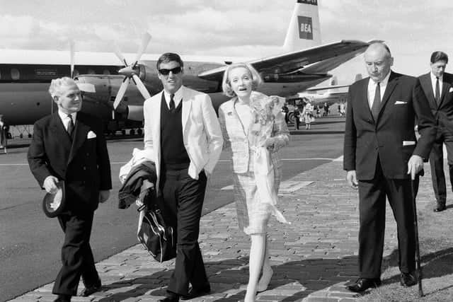 Burt Bacharach and Marlene Dietrich, centre, arriving in August 1965. (Photo by The Scotsman)
