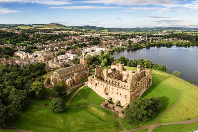 The skyline of Linlithgow, including the ruins of Linlithgow Palace and St. Michael's church from the air