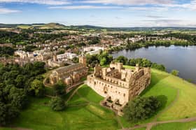 The skyline of Linlithgow, including the ruins of Linlithgow Palace and St. Michael's church from the air