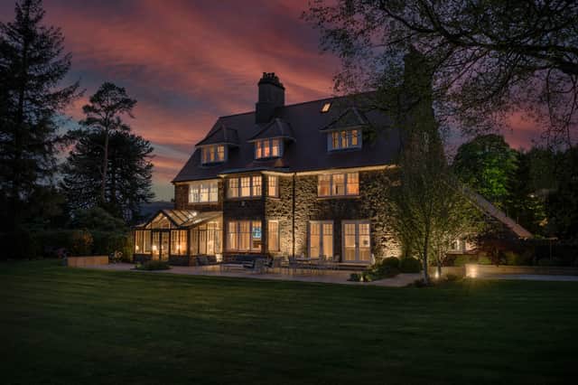 Approached via a private driveway the house has a dramatic appearance at night