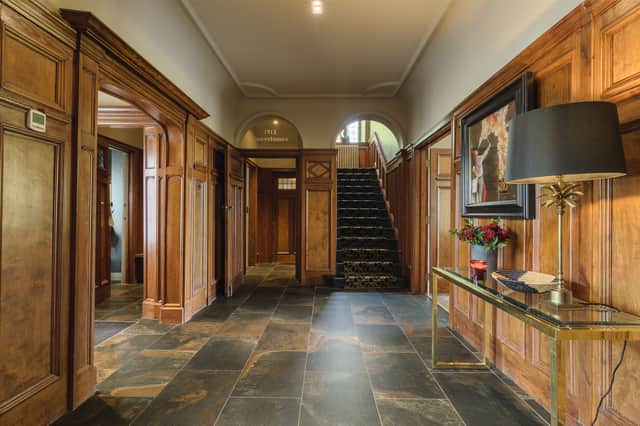 The wood panelled entrance hall.