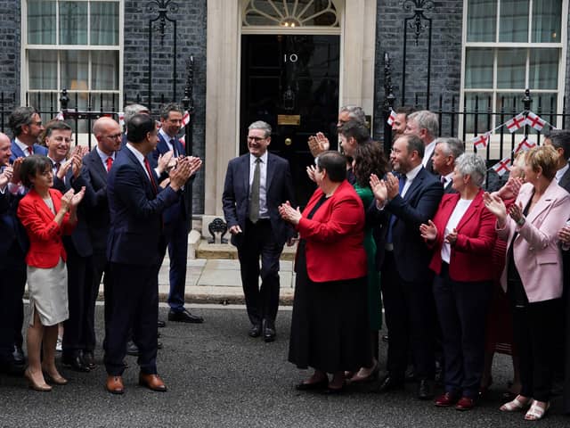 Prime Minister Sir Keir Starmer is applauded by Scottish Labour leader Anas Sarwar (centre left) and the new intake of Scottish Labour MPs