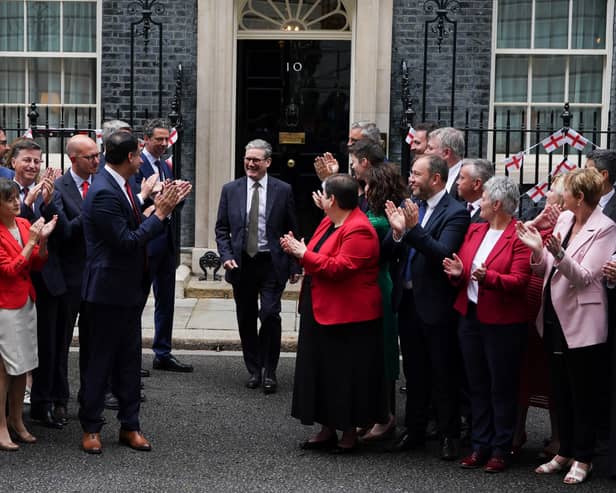 Prime Minister Sir Keir Starmer is applauded by Scottish Labour leader Anas Sarwar (centre left) and the new intake of Scottish Labour MPs