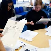Pupils at Craigmount High receiving their SQA exam results last year. Some students opt to wait and open them together (Photo: Jeff J Mitchell/Getty Images)