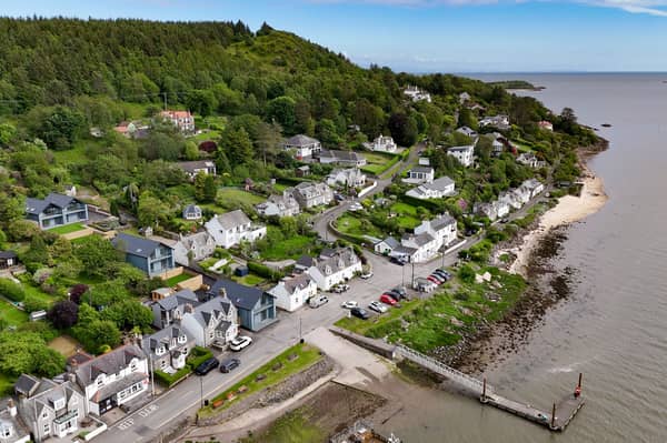 The coastal village of Kippford, with the three striking new homes
