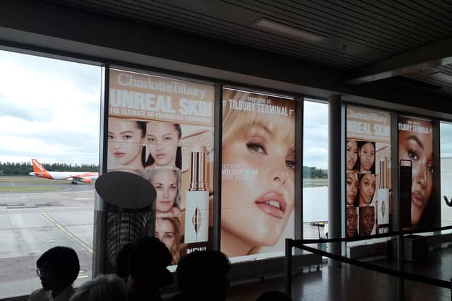 Advertising on windows in the Edinburgh Airport departure area. (Photo by The Scotsman)