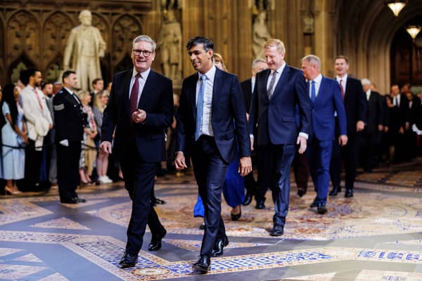 Keir Starmer and Rishi Sunak walk side by side as they lead MPs into the House of Lords for the King's Speech (Picture: Dan Kitwood/pool/AFP via Getty Images)