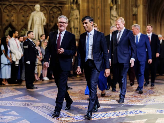 Keir Starmer and Rishi Sunak walk side by side as they lead MPs into the House of Lords for the King's Speech (Picture: Dan Kitwood/pool/AFP via Getty Images)