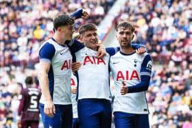 Mikey Moore (centre) scored for Spurs in a rampant second-half display.