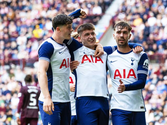 Mikey Moore (centre) scored for Spurs in a rampant second-half display.