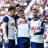 Mikey Moore (centre) scored for Spurs in a rampant second-half display.