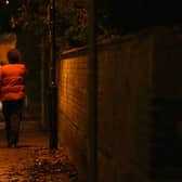 A lone woman hurries on her way along streets that no longer feel safe for many (Picture: Chris Young/AFP via Getty Images)