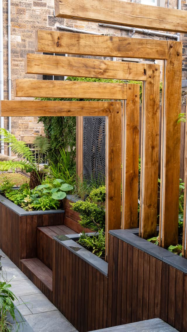 A focal point is created from solid oak beams, blurring the line between gardening and art