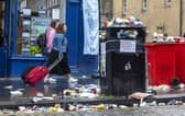 An overflowing bin on Edinburgh's Royal Mile as waste strikes stretched into a fifth day