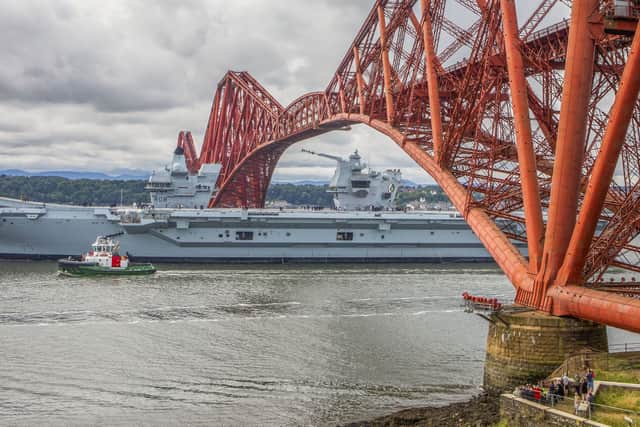 The HMS Queen Elizabeth in motion following the completion of repairs at Rosyth