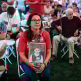 Francine Wheeler displays a photograph of her son, Sandy Hook Elementary shooting victim Ben Wheeler, at a rally in Newtown, Connecticut (Picture: Kena Betancur/AFP via Getty Images)