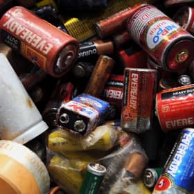 A pile of dead batteries. Photo: Manjunath Kiran/AFP via Getty Images