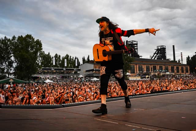 Eugene Hutz of Gogol Bordello performs on stage during the "Colours of Ostrava" music festival in Ostrava on July 17, 2024. (Photo by Michal Cizek / AFP)