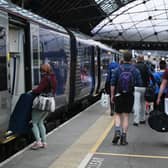 Passengers at Glasgow Queen Street, among stations where ScotRail services have been reduced. (Photo by John Devlin/The Scotsman)