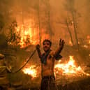 Everyone needs to work together to tackle the climate emergency (Picture: Angelos Tzortzinis/AFP via Getty Images)