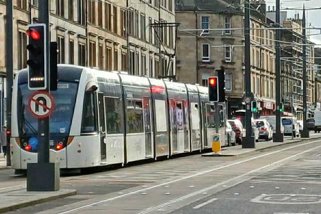 A tram in traffic on Leith Walk near Pilrig Street