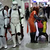 Cosplayers attend the MCM Comic Con at ExCeL exhibition centre in London on October 27, 2023. (Photo by HENRY NICHOLLS / AFP) 
