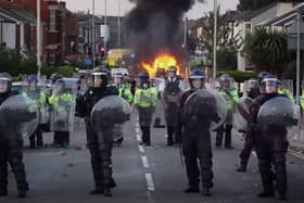 Riot police hold back protesters after disorder broke out on July 30, 2024 in Southport, England. Rumours about the identity of the 17-year-old suspect in yesterday's deadly stabbing attack here have sparked a violent protest. 