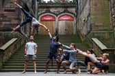 Acrobats from the troupe Gravity & Other Myths perform their new show 'Ten Thousand Hours' outside Assembly Hall. 