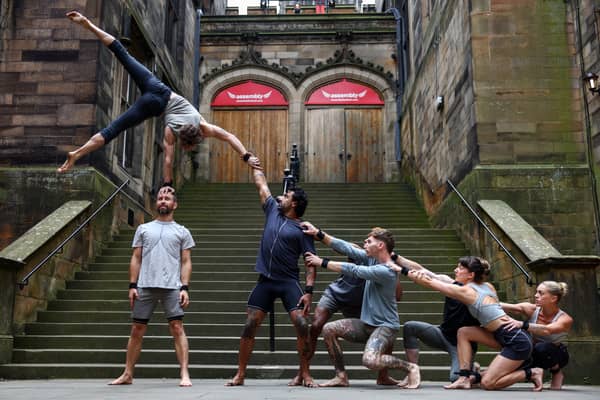 Acrobats from the troupe Gravity & Other Myths perform their new show 'Ten Thousand Hours' outside Assembly Hall. 