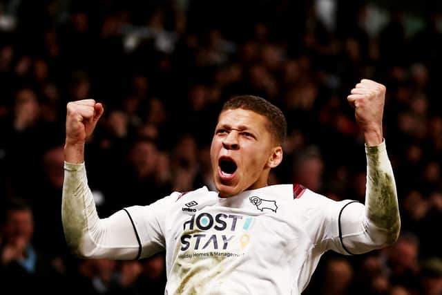 Dwight Gayle, pictured celebrating a goal for Derby last season, has signed for Hibs.
