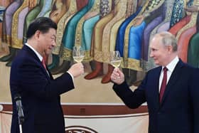Russian President Vladimir Putin and China's President Xi Jinping toast each other following talks at the Kremlin in March 2023 (Picture: Pavel Byrkin/Sputnik/AFP via Getty Images)
