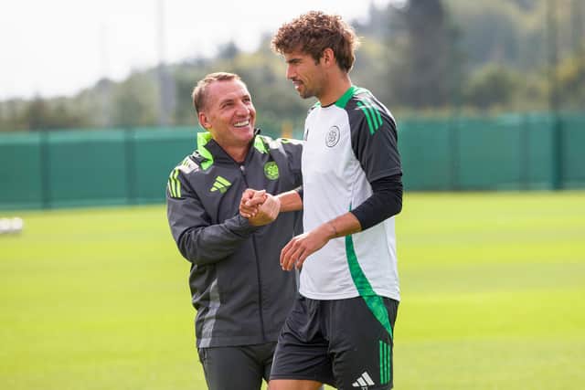 Brendan Rodgers is all smiles with Matt O'Riley during a Celtic training session on Friday