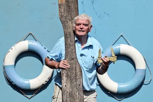 Former Glasgow Humane Society officer George Parsonage with the seat of the boat that won the 1900 World Lifesaving Championships in Paris