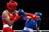 Algeria's Imane Khelif, in red, punches Italy's Angela Carini in the women's 66kg boxing event at the Paris Olympics on Thursday (Picture: Mohd Rasfan/AFP via Getty Images)