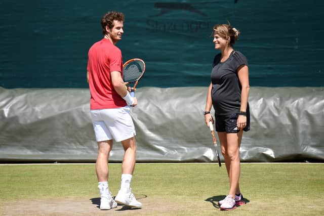 Murray chats with Amelie Mauresmo during training in 2015