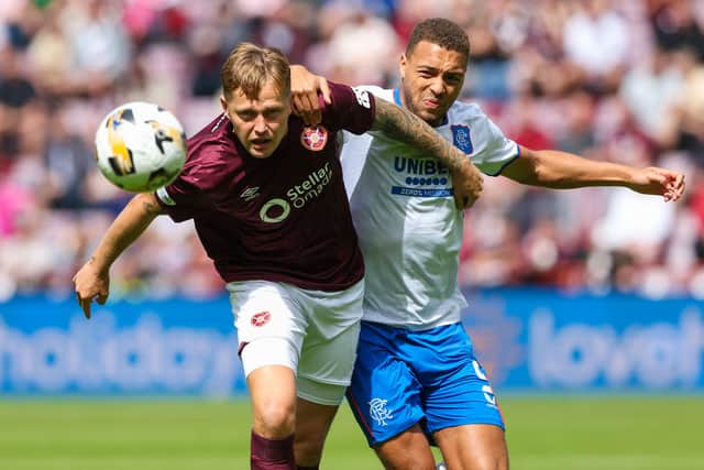 Hearts' Frankie Kent gets the better of Rangers striker Cyriel Dessers at Tynecastle