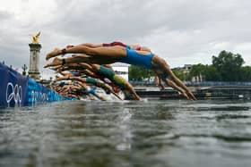 Athletes jump into in the River Seine during the women's individual triathlon at the Paris 2024 Olympic Games (Picture: Martin Bureau/pool/Getty Images)