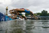 Athletes jump into in the River Seine during the women's individual triathlon at the Paris 2024 Olympic Games (Picture: Martin Bureau/pool/Getty Images)