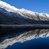 The snow covered peaks in Glencoe reflected in Loch Achtriochtan