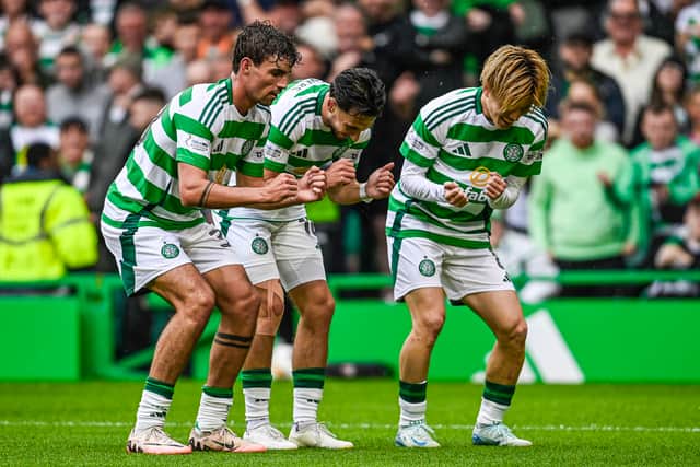 Celtic's Nicolas Kuhn celebrates with Matt O'Riley and Kyogo Furuhashi after scoring to make it 3-0 against Kilmarnock