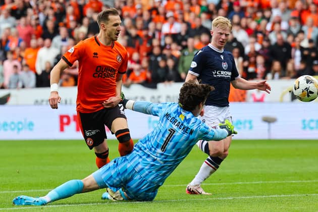Dundee United's Kristijan Trapanovski has a shot on target but it's cleared off the line by Dundee's Lyall Cameron